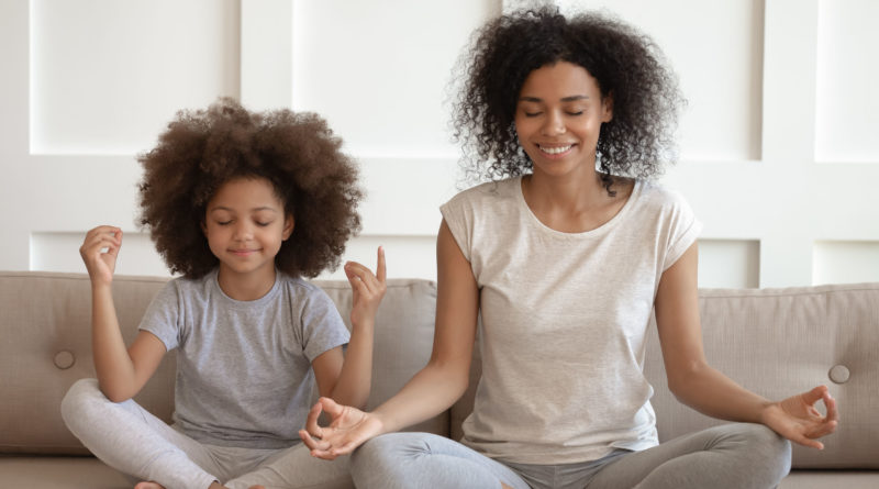 family meditates during Covid to relieve stress, advised by Talking Health & Wellness